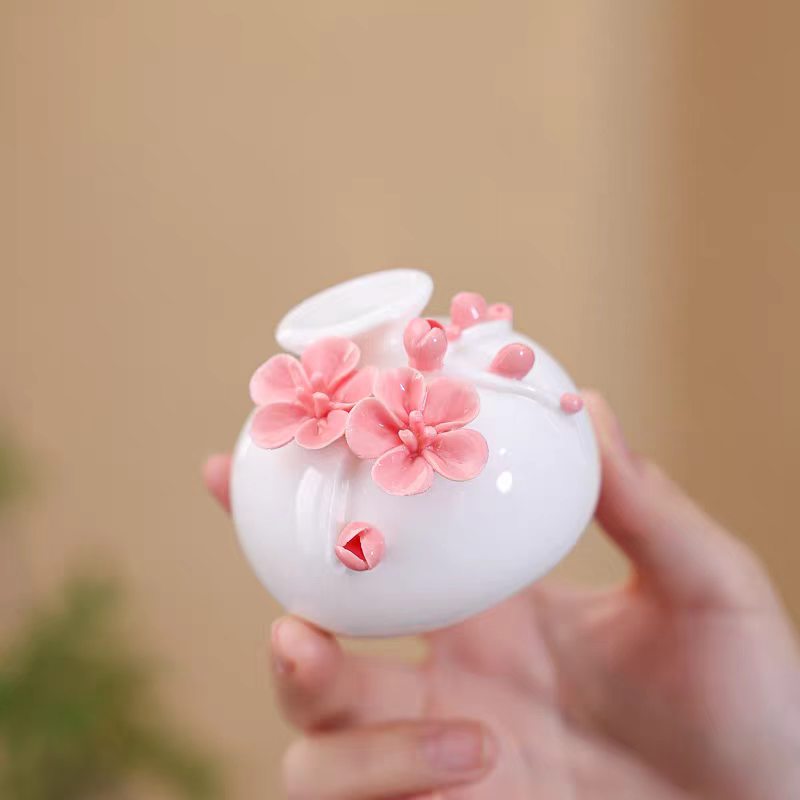 Jingdezhen Ceramic Plum Blossom Relief Vase with Plum Branch Arrangement — Handcrafted Porcelain Tea Desk Decor