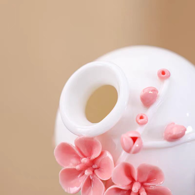 Jingdezhen Ceramic Plum Blossom Relief Vase with Plum Branch Arrangement — Handcrafted Porcelain Tea Desk Decor