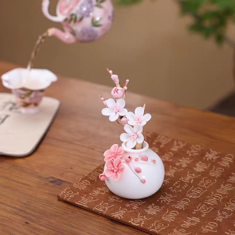 Jingdezhen Ceramic Plum Blossom Relief Vase with Plum Branch Arrangement — Handcrafted Porcelain Tea Desk Decor